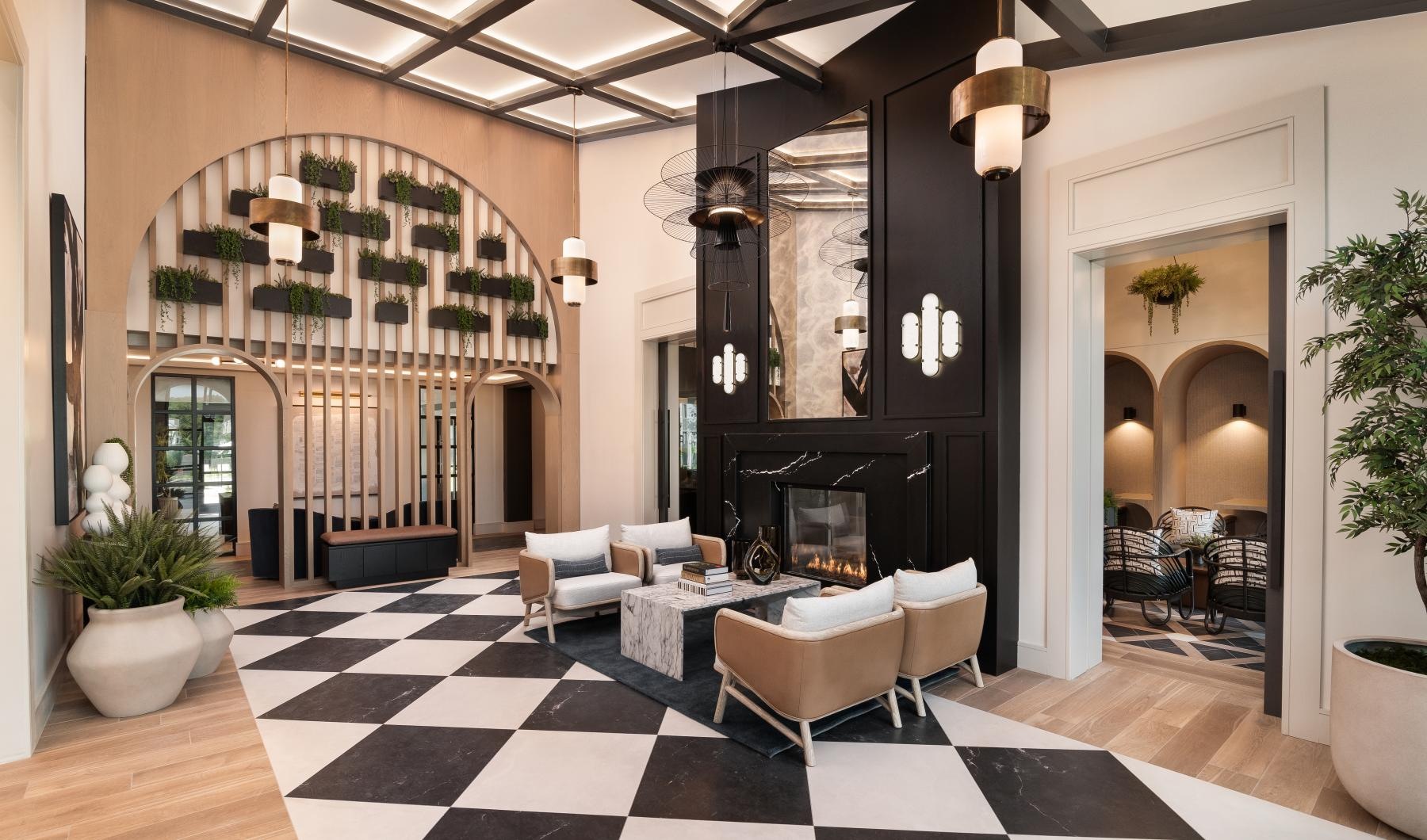 a room with a fireplace and chairs