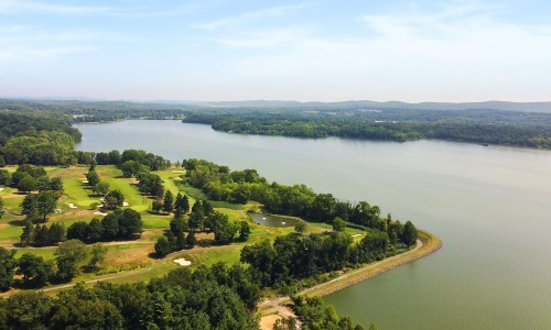 a body of water with trees around it